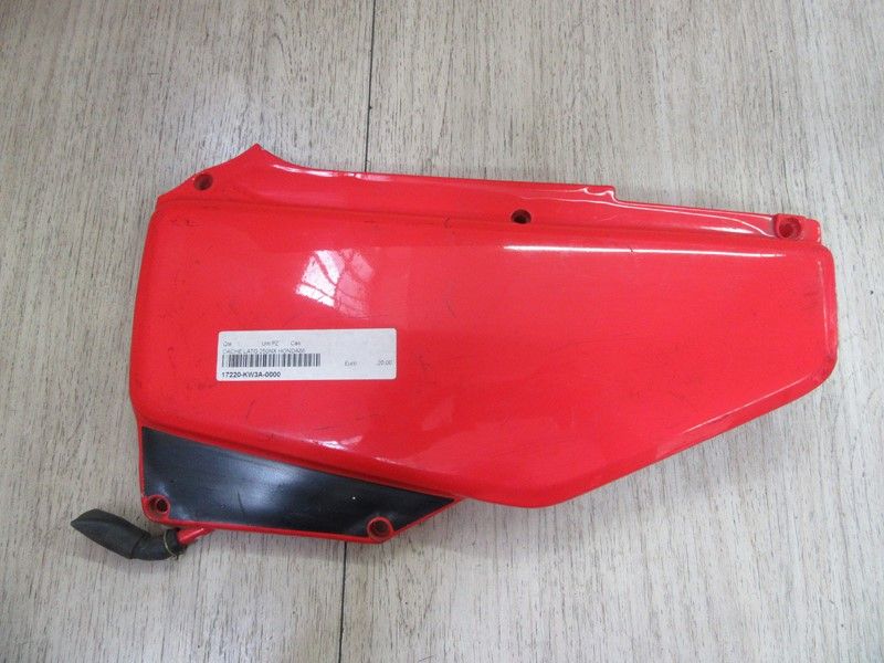 Cache latéral gauche Honda 250 NX 1988-1996 (17220-KW3A-0000)