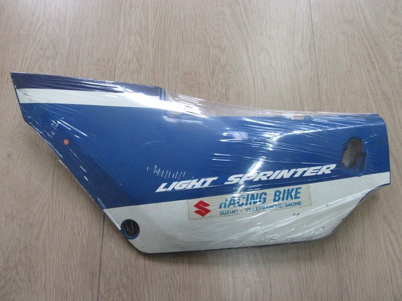 Cache latéral gauche Suzuki 125 RG 1988 (NF12B) 47211-36A00-000